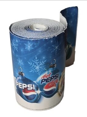 Mountain Dew Christmas Soda Roll with blue background, snowflakes, and Diet Peps